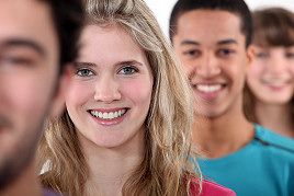 A row of young and smiley people